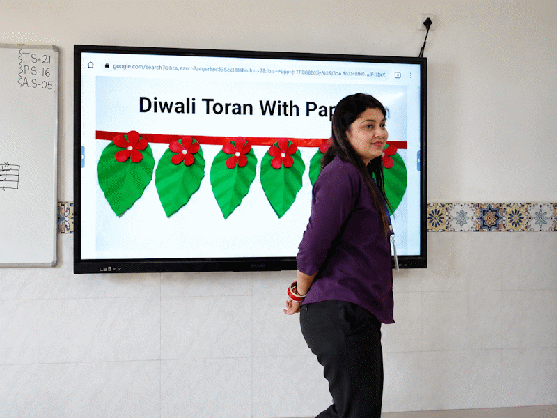 Teacher guiding young learners