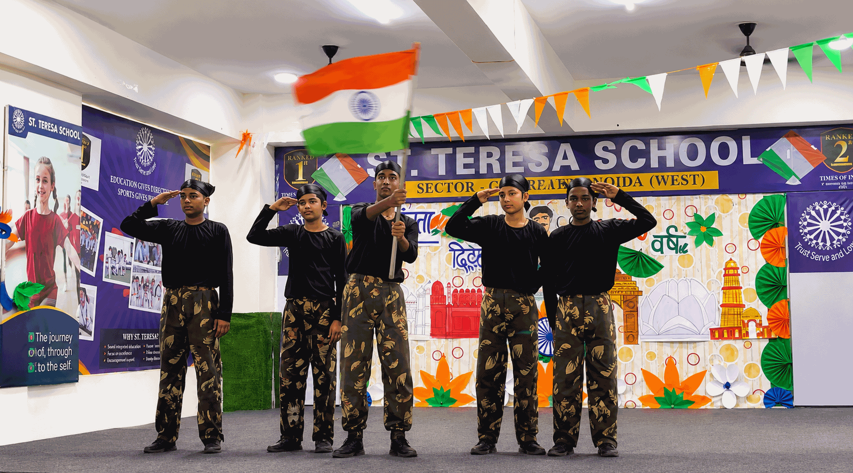 Students of St. Teresa School saluting on stage with the Indian tricolour during the Independence Day celebration